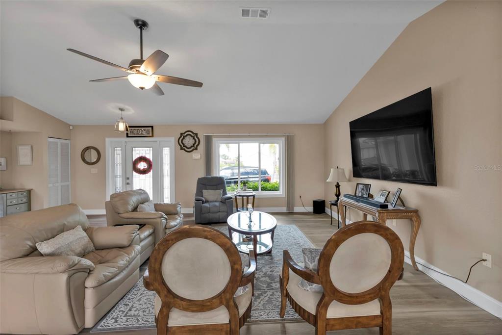 820 Bal Harbor Boulevard Punta Gorda, FL 33950 - Photo 51 of 56 a living room with furniture a window and a flat screen tv