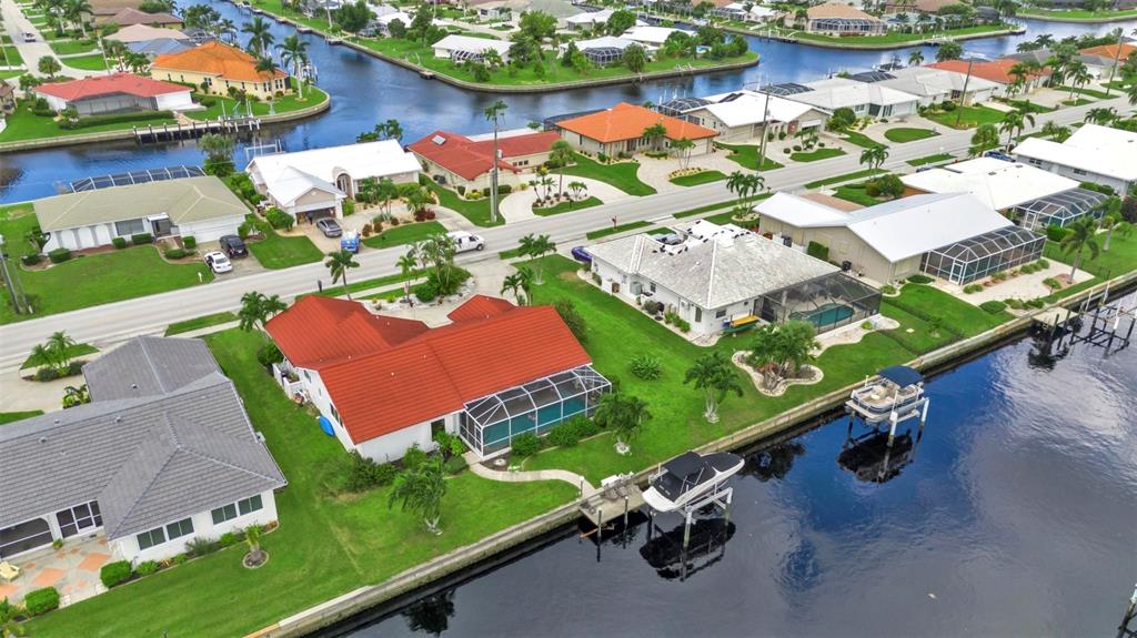 820 Bal Harbor Boulevard Punta Gorda, FL 33950 - Photo 6 of 56 an aerial view of a pool patio yard and outdoor seating