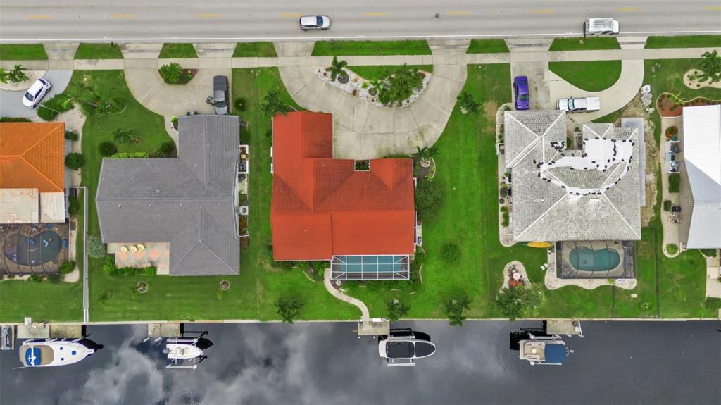 820 Bal Harbor Boulevard Punta Gorda, FL 33950 - Photo 8 of 56 an aerial view of a house with a yard and garage