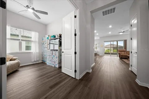 a view of a living room and a wooden floor