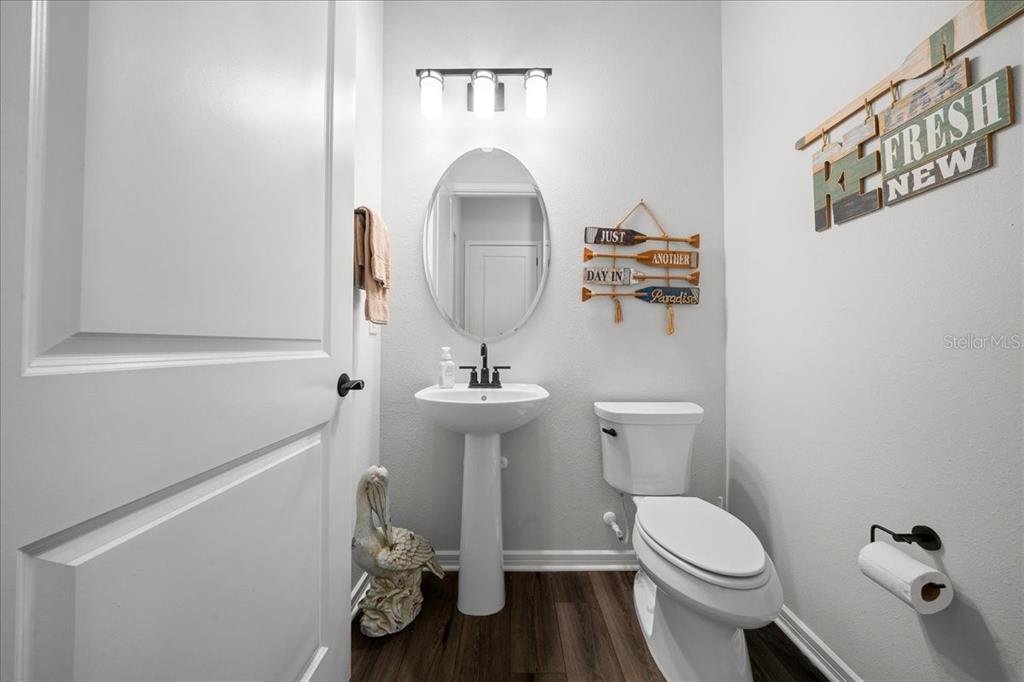 8750 Southwest 59th Ln Road Ocala, FL 34481 - Photo 16 of 41 a bathroom with a toilet a sink and mirror