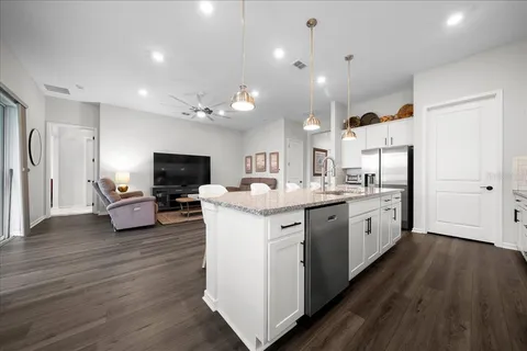 a large bathroom with a double vanity sink and mirror