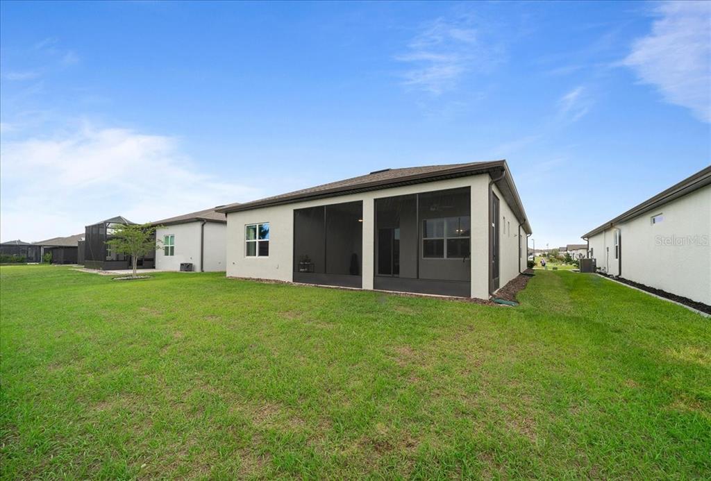8750 Southwest 59th Ln Road Ocala, FL 34481 - Photo 4 of 41 a front view of house with yard and green space