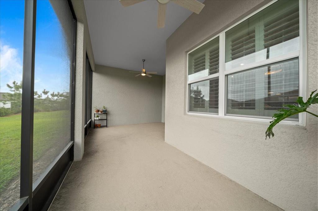 8750 Southwest 59th Ln Road Ocala, FL 34481 - Photo 5 of 41 a view of an entryway with wooden floor and windows