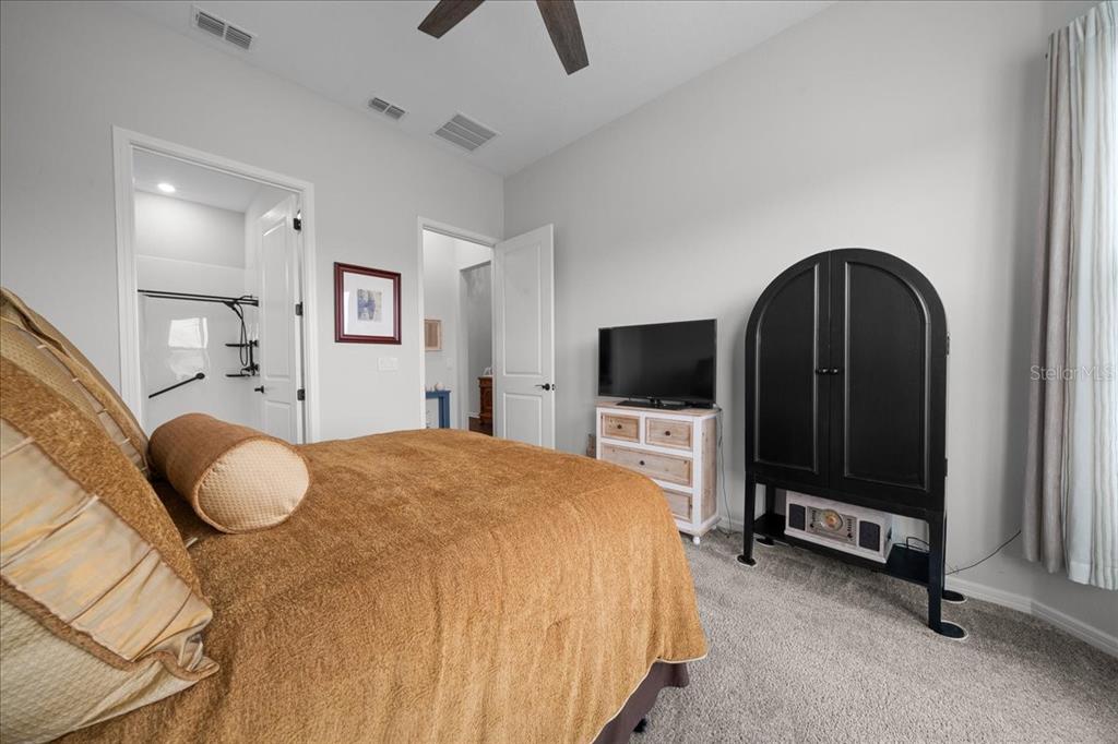 8750 Southwest 59th Ln Road Ocala, FL 34481 - Photo 10 of 41 a bedroom with a bed and a television