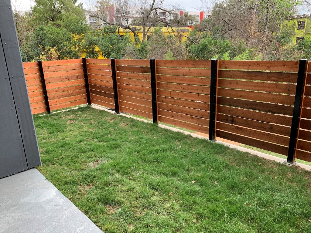 2209 South 1st Street, Unit 113 Austin, TX 78704 - Photo 6 of 16 a view of a bench in the backyard