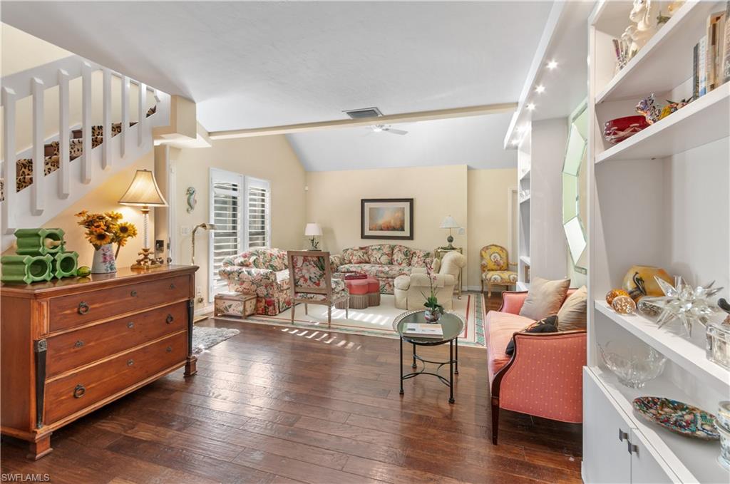 1313 Solana Road, Unit A3 Naples, FL 34103 - Photo 6 of 29 Living room featuring vaulted ceiling, dark wood-style flooring, and ceiling fan