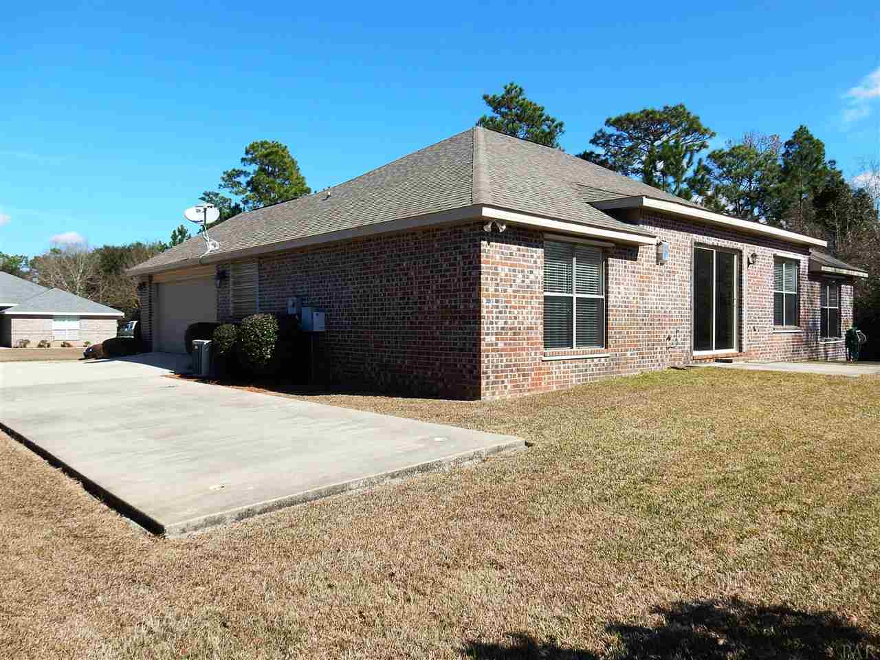32615 Arbor Ridge Circle Lillian, AL 36549 - Photo 24 of 27 a house with trees in front of it
