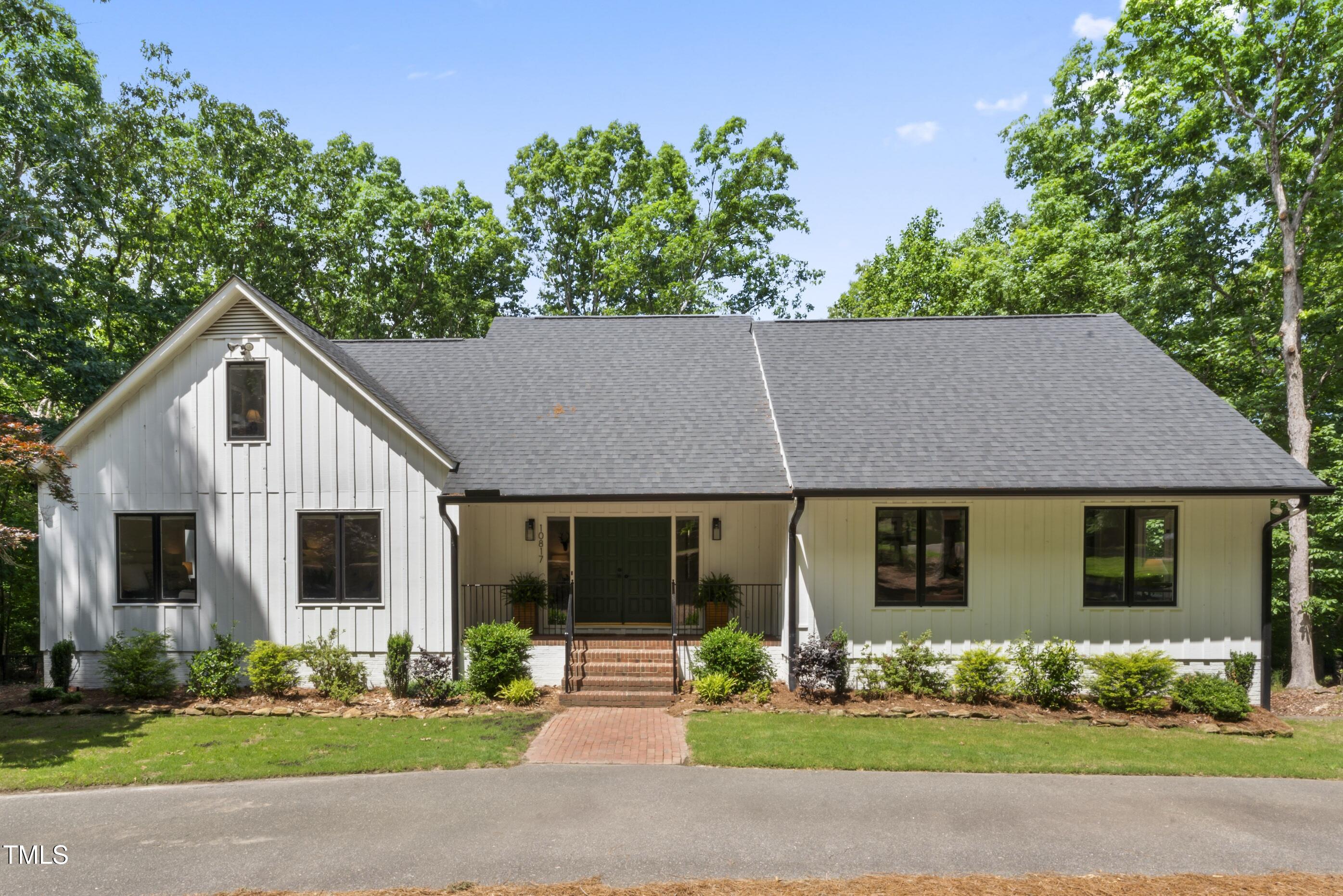 10817 Brass Kettle Road Raleigh, NC 27614 - Photo 1 of 55 front view of a house with a yard