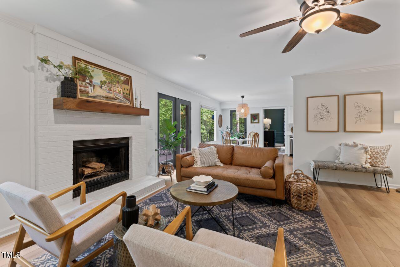10817 Brass Kettle Road Raleigh, NC 27614 - Photo 11 of 55 a living room with furniture and a fireplace