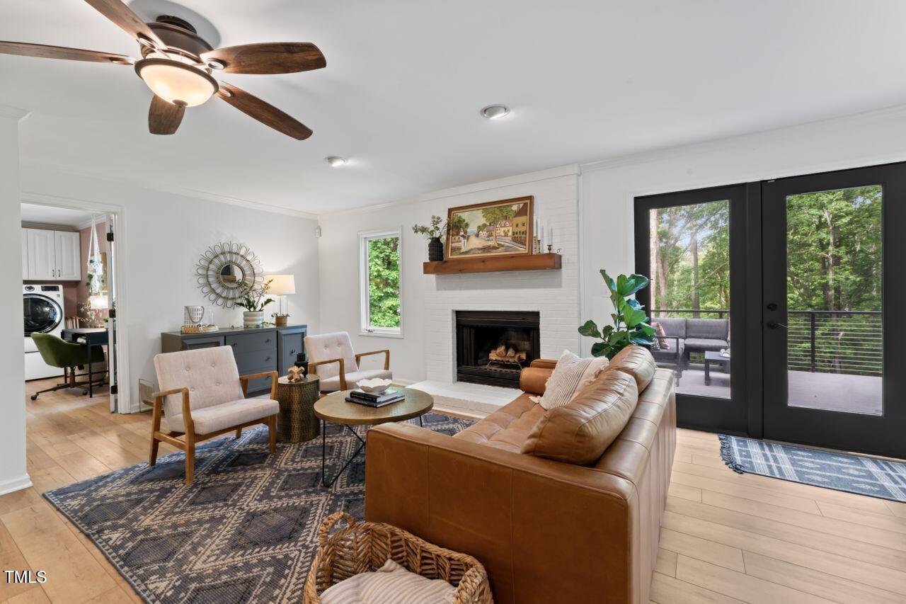 10817 Brass Kettle Road Raleigh, NC 27614 - Photo 12 of 55 a living room with furniture fireplace and window