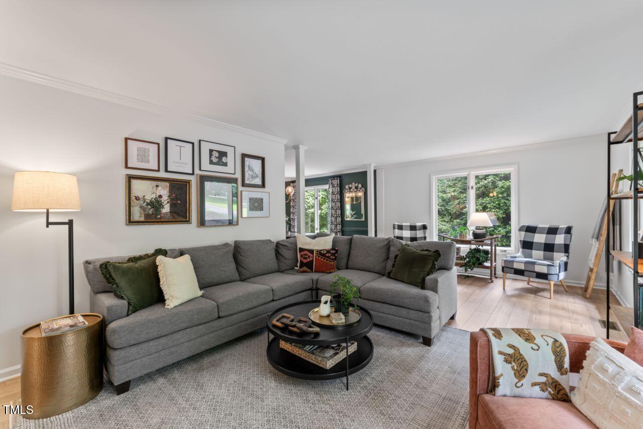 10817 Brass Kettle Road Raleigh, NC 27614 - Photo 21 of 55 a living room with furniture and a large window