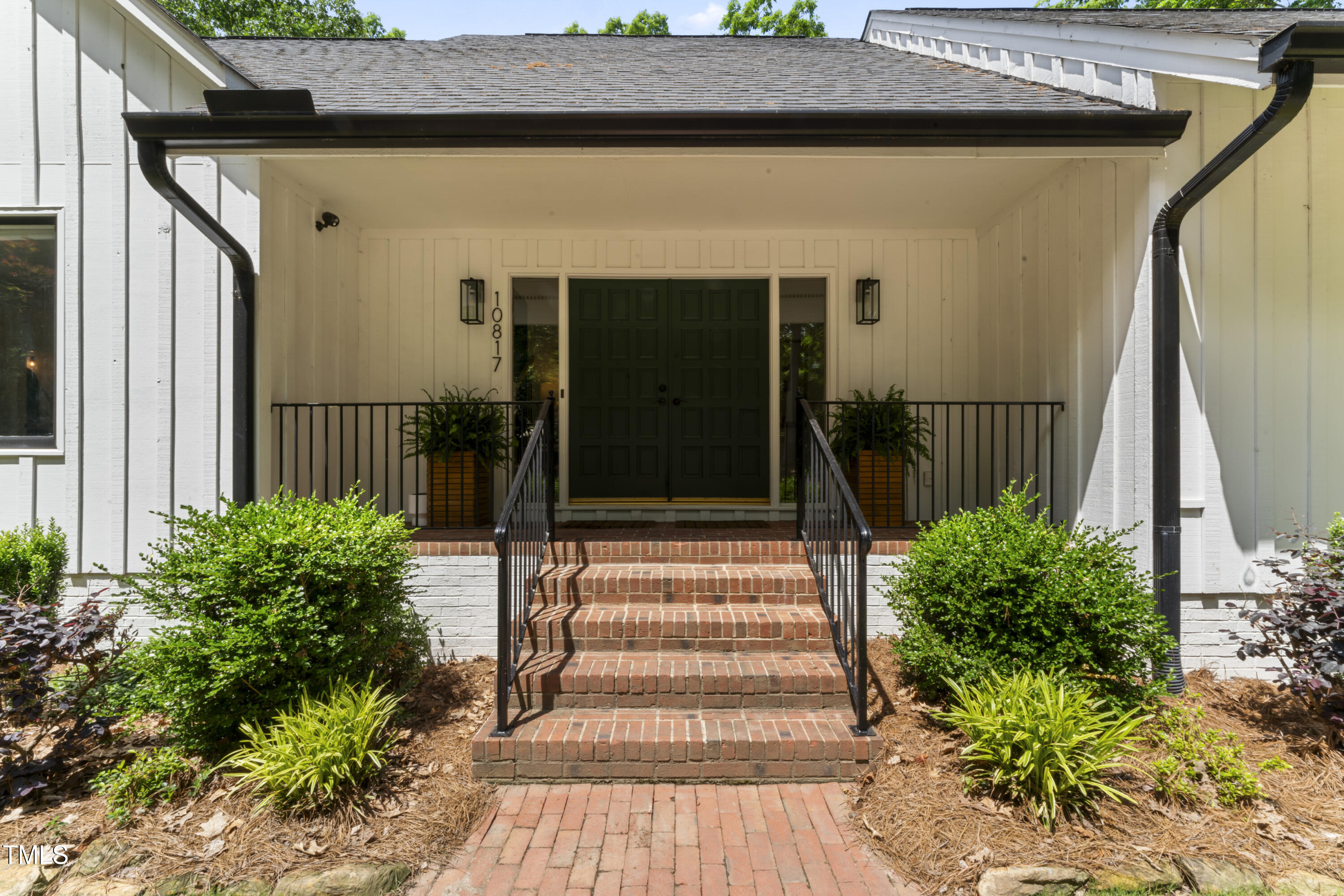 10817 Brass Kettle Road Raleigh, NC 27614 - Photo 2 of 55 a front view of a house with a garden