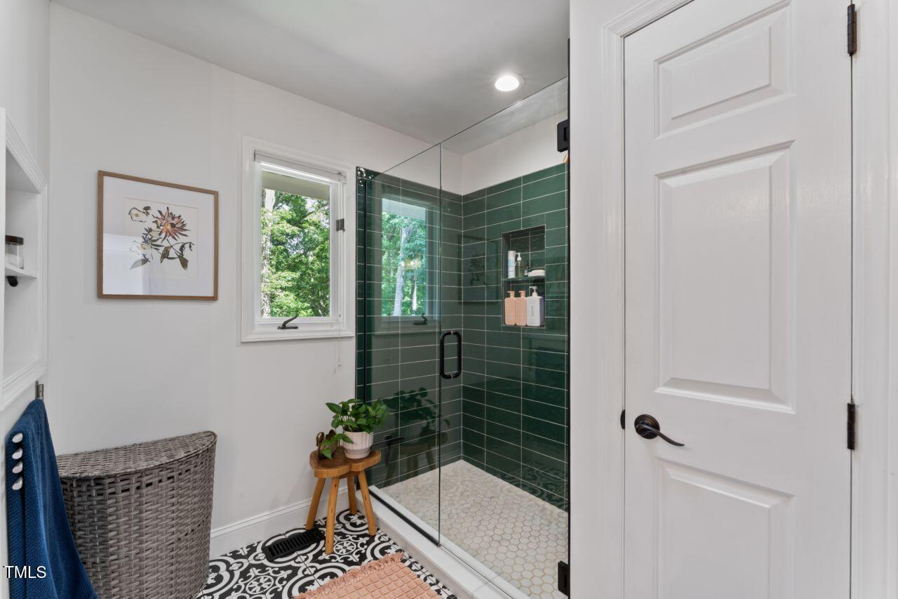 10817 Brass Kettle Road Raleigh, NC 27614 - Photo 27 of 55 a bathroom with a bathtub and shower