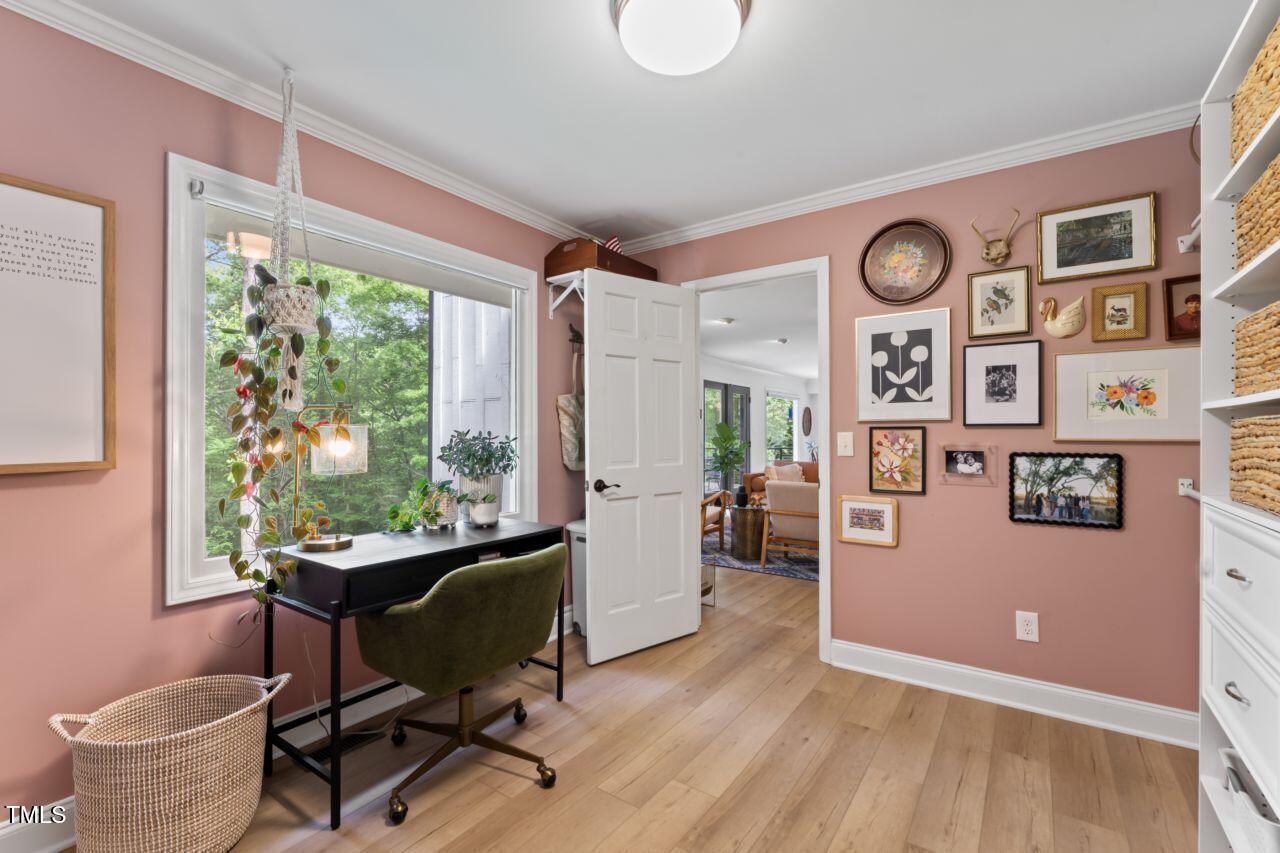 10817 Brass Kettle Road Raleigh, NC 27614 - Photo 30 of 55 a view of a workspace with furniture and a window