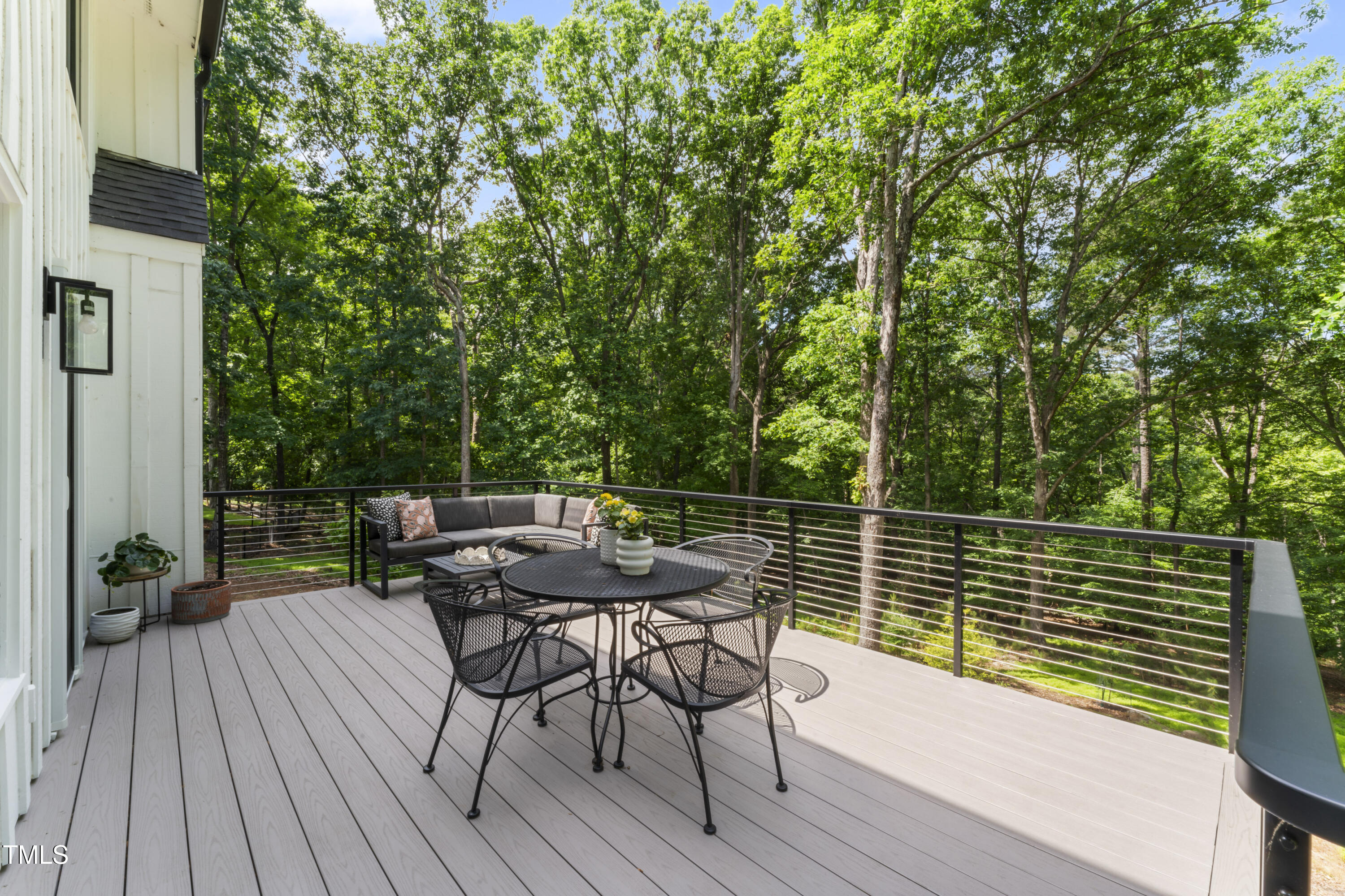 10817 Brass Kettle Road Raleigh, NC 27614 - Photo 32 of 55 a view of backyard with a table and chairs
