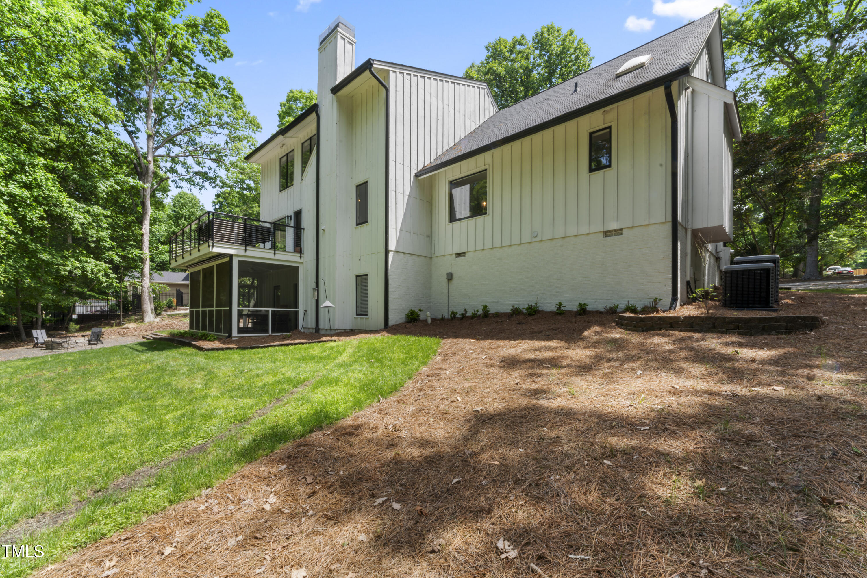 10817 Brass Kettle Road Raleigh, NC 27614 - Photo 46 of 55 a backyard of a house with wooden fence and large trees