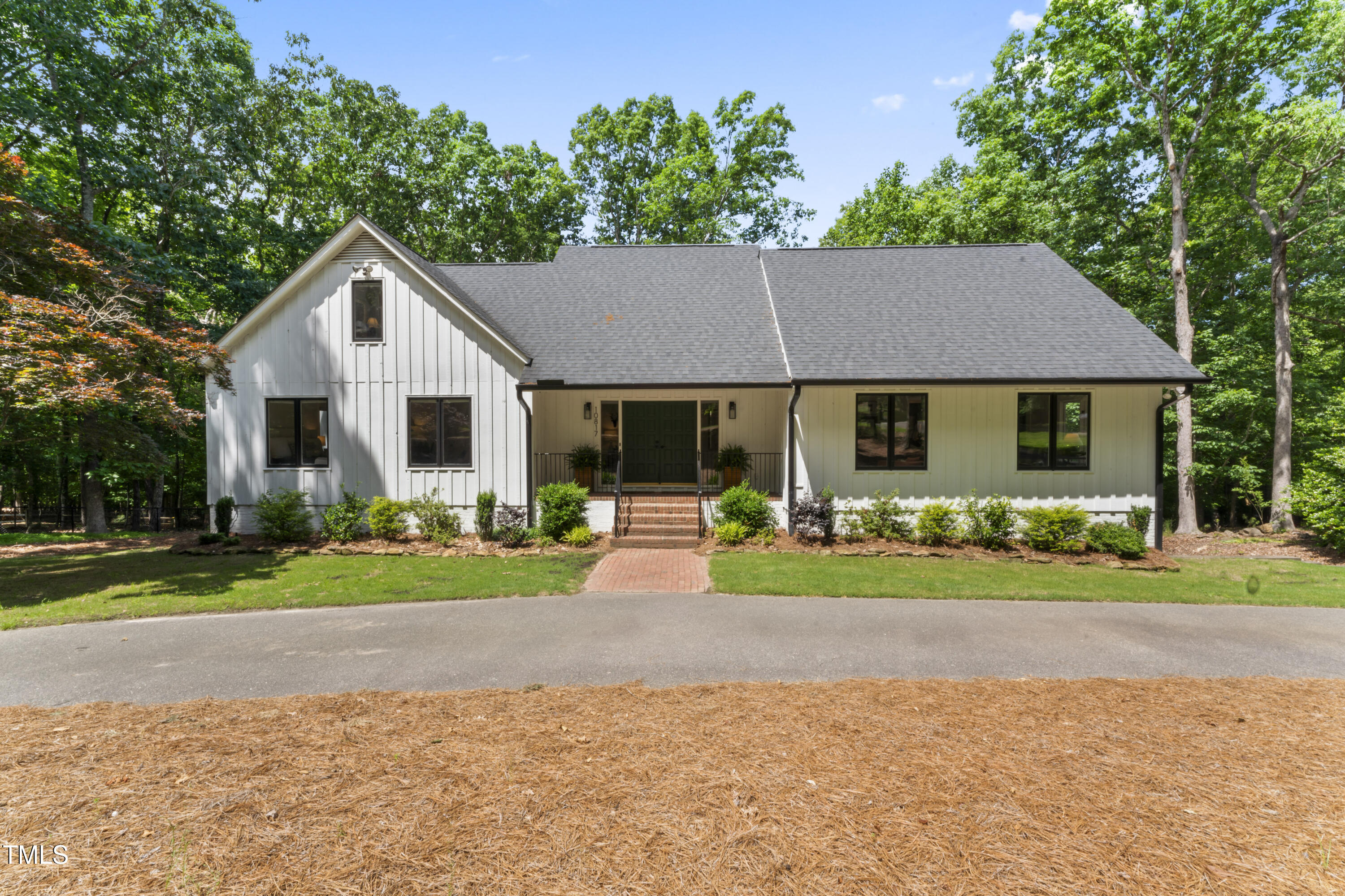 10817 Brass Kettle Road Raleigh, NC 27614 - Photo 49 of 55 a front view of a house with a yard and porch