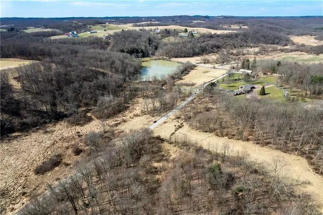 a view of a yard with mountains in the background
