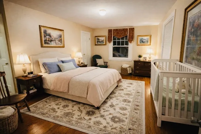 a bedroom with a large bed and a window