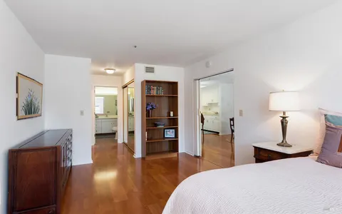 a bedroom with a bed and a view of bedroom