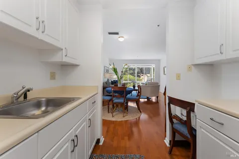 a kitchen with a sink and cabinets