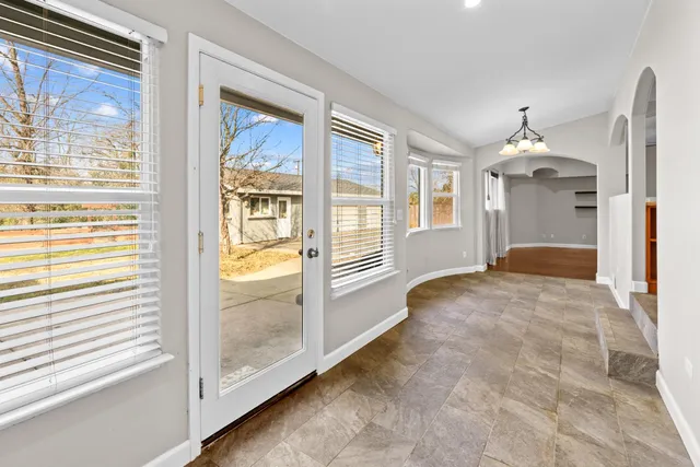 a view of a hallway with windows