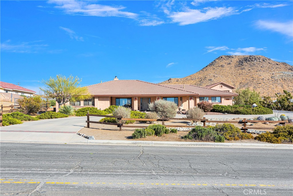 16585 Choco Road Apple Valley, CA 92307 - Photo 1 of 1 an outdoor space with lots of white furniture