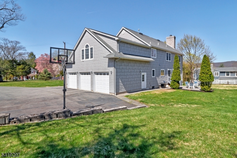 24 Pine Brook Road Montville, NJ 07082 - Photo 25 of 27 a front view of a house with a yard and garage