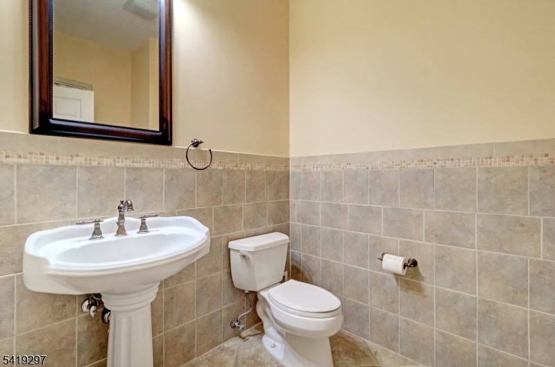 24 Pine Brook Road Montville, NJ 07082 - Photo 8 of 27 a bathroom with a sink toilet and a mirror