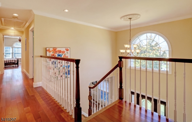 24 Pine Brook Road Montville, NJ 07082 - Photo 10 of 27 a view of staircase with railing and a chandelier