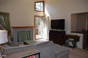 5500 Fortunes Ridge Drive, Unit 85C Durham, NC 27713 - Photo 45 of 50 a living room with furniture and a flat screen tv
