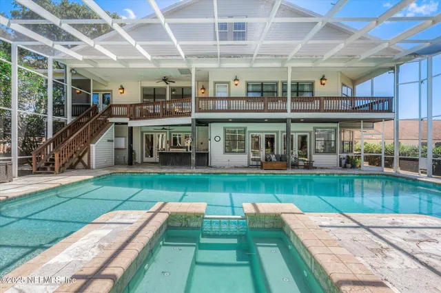 a view of a swimming pool with a patio