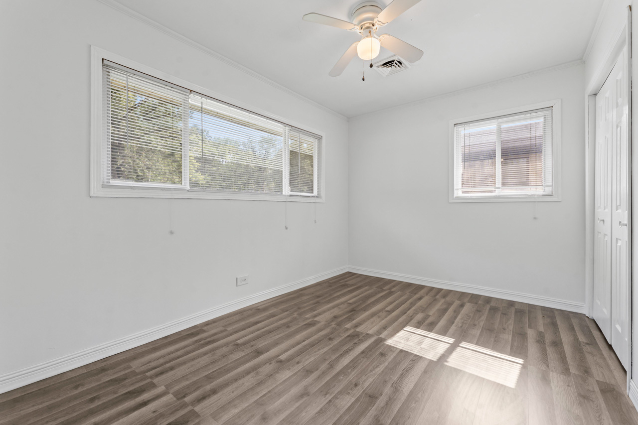 134 Monee Road Park Forest, IL 60466 - Photo 12 of 23 a view of an empty room with wooden floor and a window