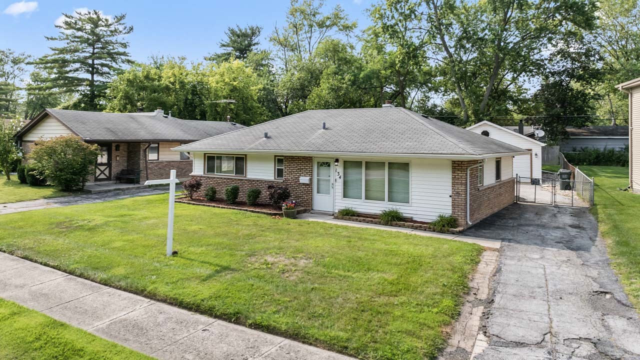 134 Monee Road Park Forest, IL 60466 - Photo 2 of 23 a backyard of a house with yard and outdoor seating
