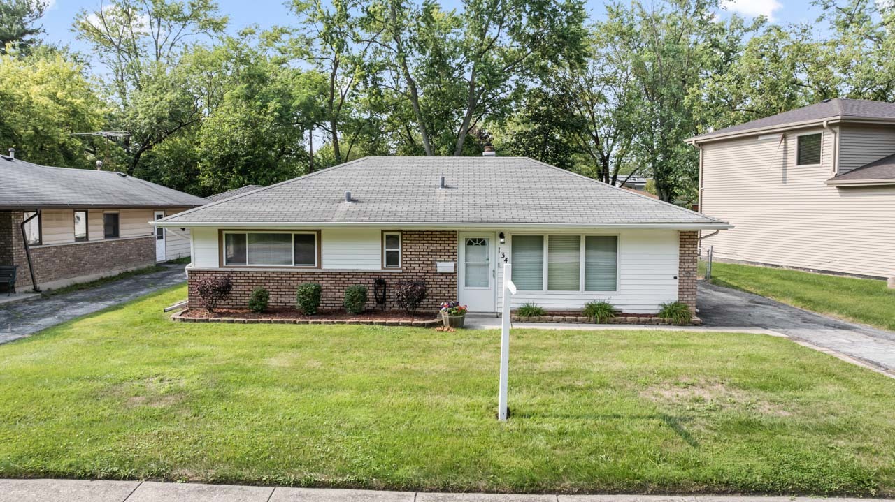 134 Monee Road Park Forest, IL 60466 - Photo 23 of 23 a front view of a house with a yard