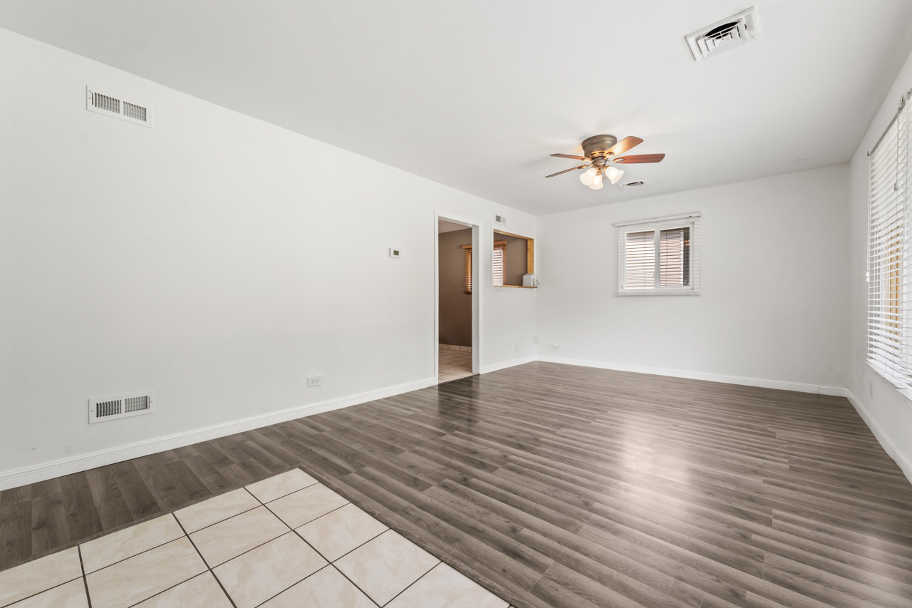 134 Monee Road Park Forest, IL 60466 - Photo 5 of 23 wooden floor in an empty room with a window