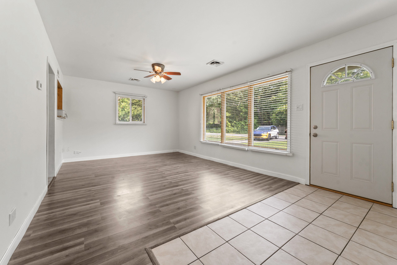 134 Monee Road Park Forest, IL 60466 - Photo 6 of 23 an empty room with windows and chandelier