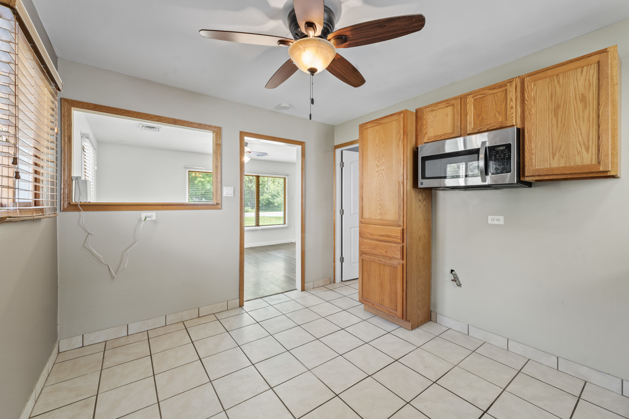 134 Monee Road Park Forest, IL 60466 - Photo 8 of 23 a view of an empty room with window and cabinet
