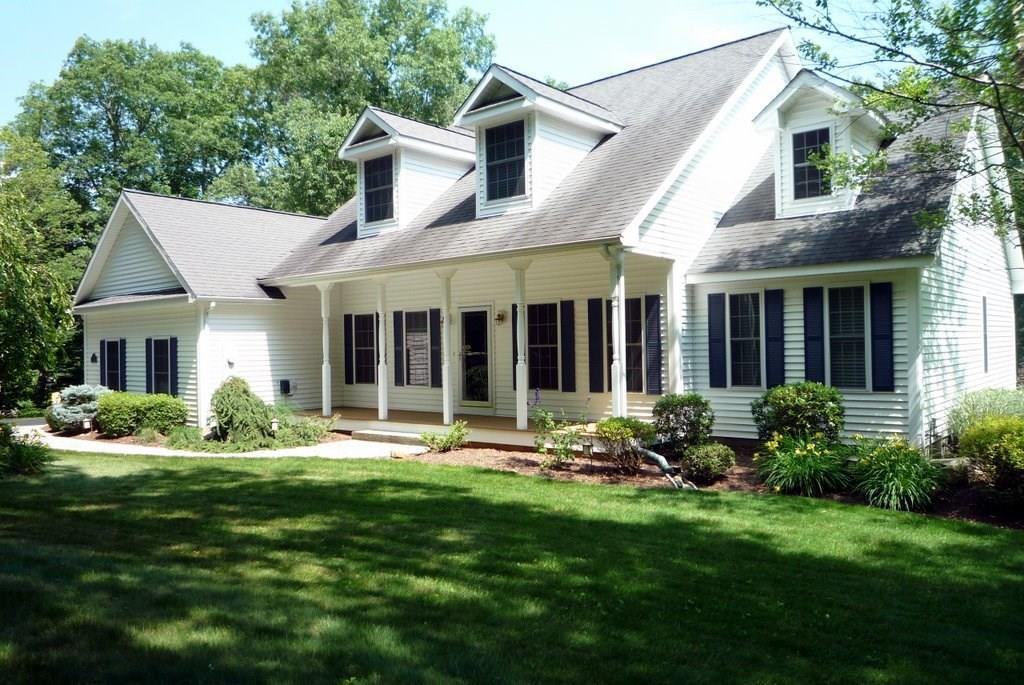 11 Stone House Road Hebron, CT 06231 - Photo 1 of 1 a front view of a house with yard and green space
