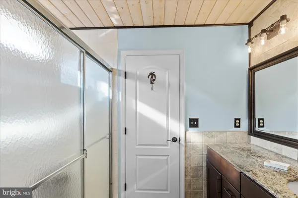 a view of a livingroom with furniture and a window