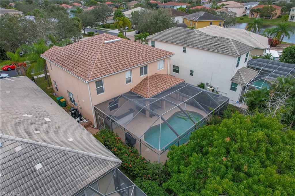 8271 Laurel Lakes Way Naples, FL 34119 - Photo 3 of 36 an aerial view of a house with balcony