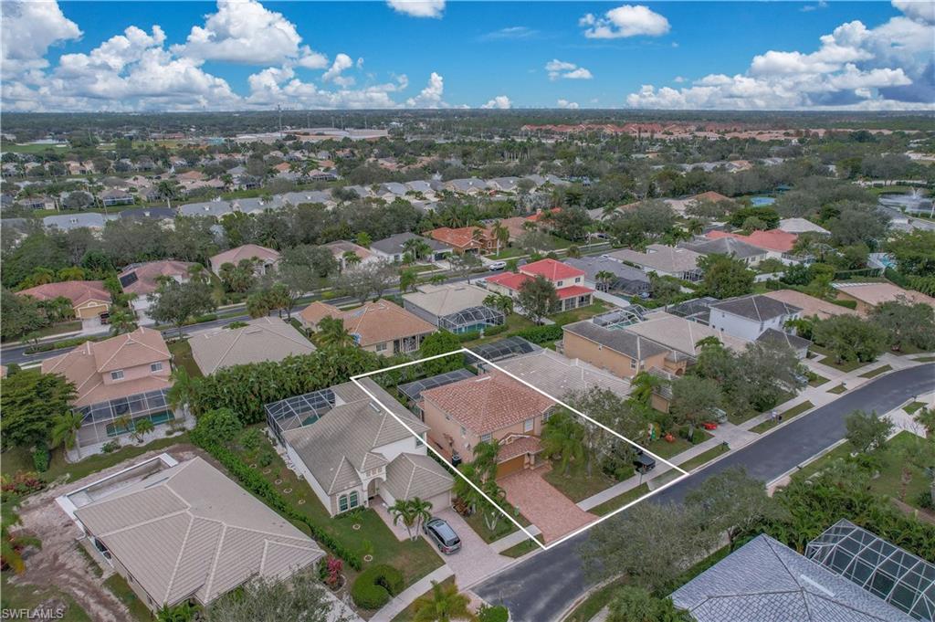 8271 Laurel Lakes Way Naples, FL 34119 - Photo 33 of 36 an aerial view of residential houses with outdoor space