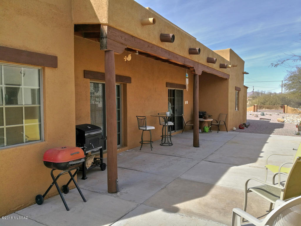 1721 Camino Jalisco Rio Rico, AZ 85648 - Photo 29 of 39 a view of a patio with table and chairs and potted plants
