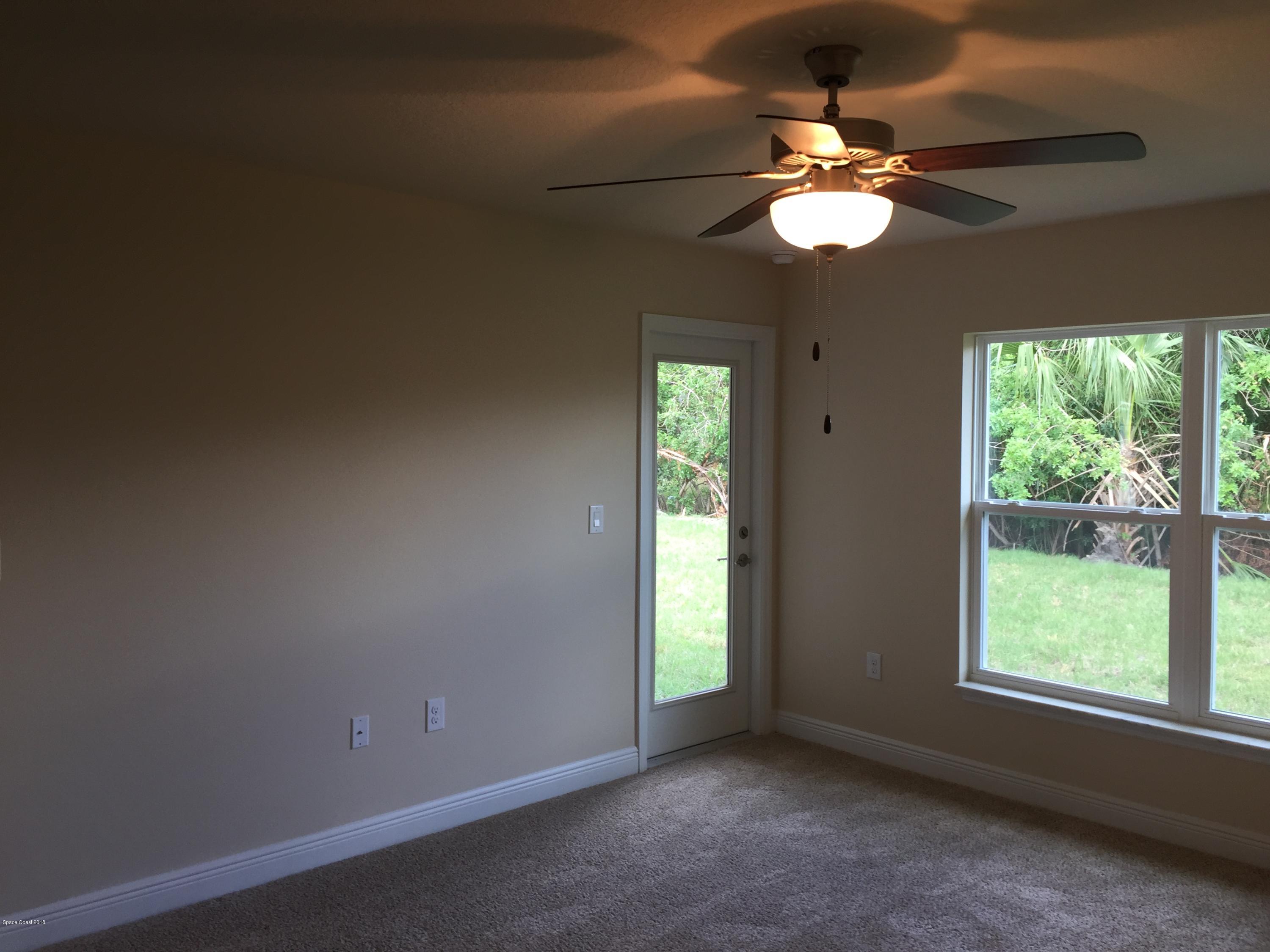 1557 Paragon Road Southeast Palm Bay, FL 32909 - Photo 9 of 18 Master Bedroom