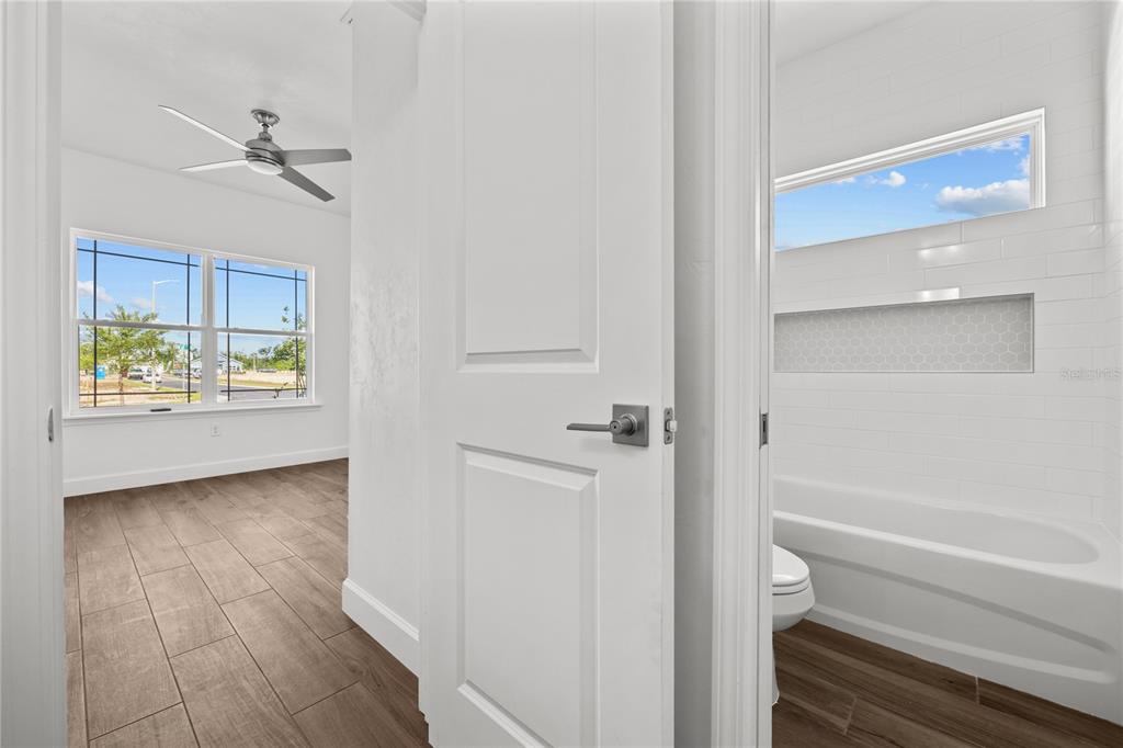 1086 Southwest 67th Drive Gainesville, FL 32607 - Photo 23 of 37 a bathroom with a bathtub and a shower
