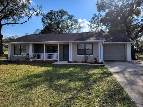 front view of a house with a yard