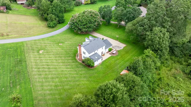 a view of a lake with a house in the background