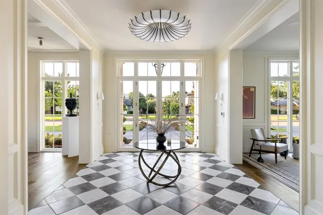 a view of a entryway with furniture and floor to ceiling window