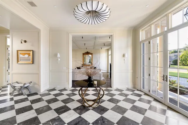 a bedroom with a bed and a mirror